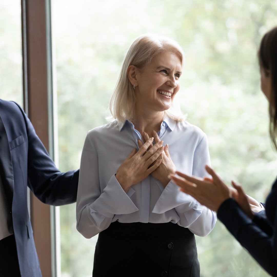 Woman holding gratitude for her co-workers